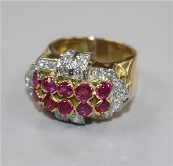 A yellow metal, ruby and diamond cluster dress ring, size O.